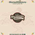Logo for MonteMaestro Colombian Specialty Coffee, featuring the text "Brewed in Medellin" with mountain outlines and colorful accents. Tone is artisanal.